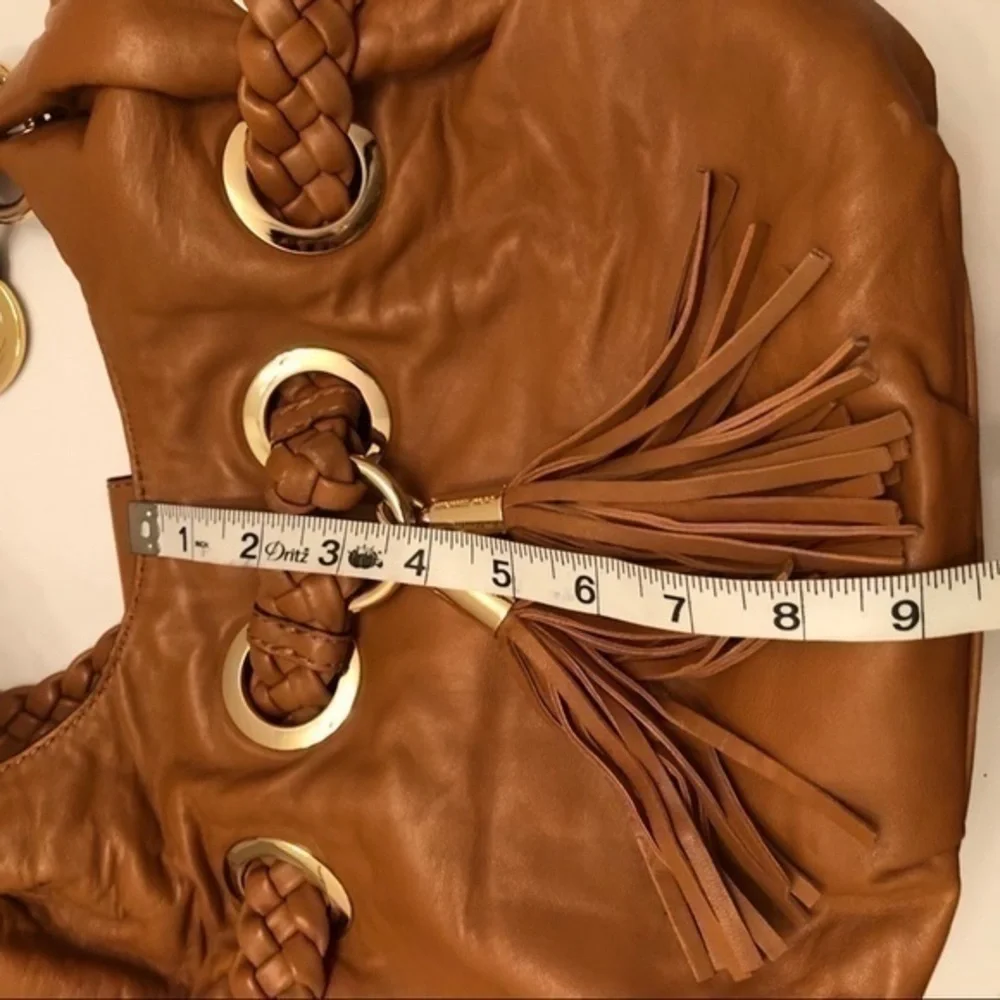 Michael kors brown leather grommet tassel bag